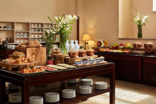 a buffet of food on a table in a room at NH Collection Palacio de Burgos in Burgos