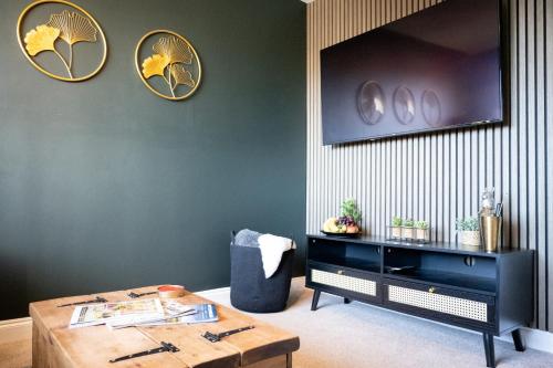 a room with a table and some plates on the wall at Northern Hideaways, The Nest Ponteland in Newcastle upon Tyne