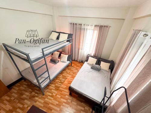 a room with two bunk beds in it at Pan-Ogifan Transient in Baguio