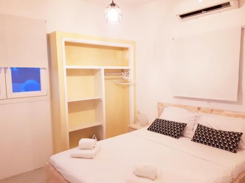 Postel nebo postele na pokoji v ubytování Santo Deluxe Suite