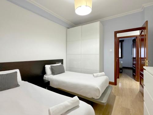 Postel nebo postele na pokoji v ubytování Santuchu Apartamento Elegante con wifi