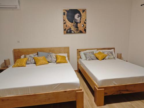 Ένα ή περισσότερα κρεβάτια σε δωμάτιο στο L'Orangeraie