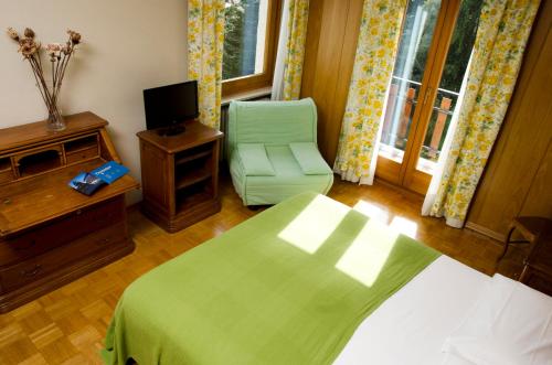 Кровать или кровати в номере Hotel Panoramique