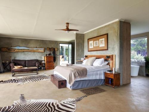 A bed or beds in a room at Savanna Villas