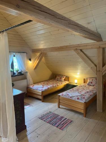 Postel nebo postele na pokoji v ubytování Siedlisko Błominko