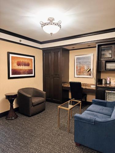 a living room with a couch and a table at Hotel Lucerne in New York