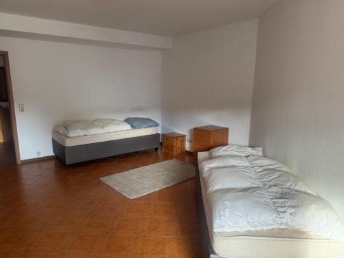 a bedroom with two beds in a room at LandgasthofOrleshausen in Büdingen