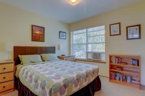 a bedroom with a large bed and a window at 13 Lodge in Hood River