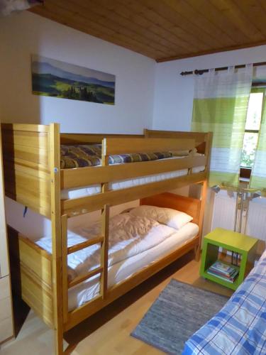 a bedroom with two bunk beds in a room at Appartement am Waldeck in Hauzenberg