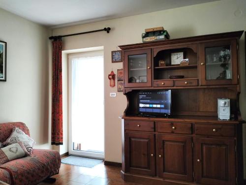 Et tv og/eller underholdning på Appartamento l'angelo