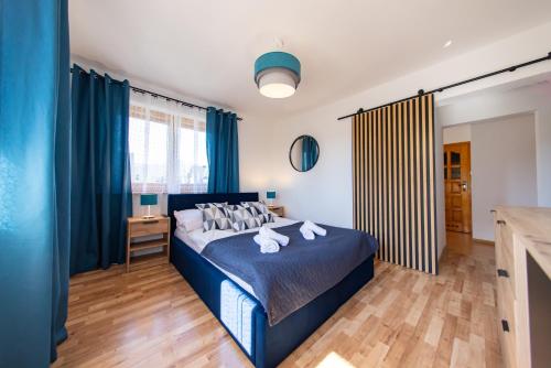 En eller flere senge i et værelse på Apartamenty Podmuch Halnego