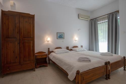 Postel nebo postele na pokoji v ubytování Hotel Agapi Apartments