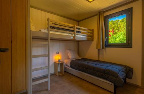 Ένα ή περισσότερα κρεβάτια σε δωμάτιο στο Camping California