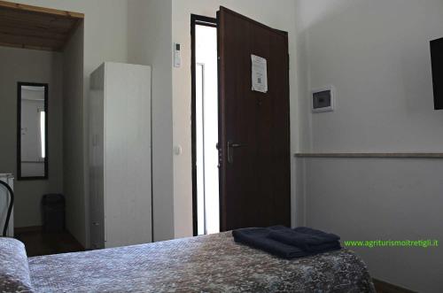 Ένα ή περισσότερα κρεβάτια σε δωμάτιο στο Agriturismo I TRE TIGLI