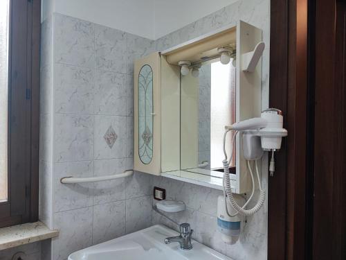 a bathroom with a sink and a mirror at Il Rifugio in Celano