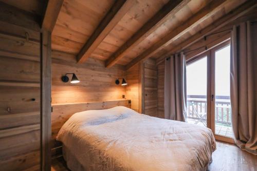 Giường trong phòng chung tại Chalet du Gouter