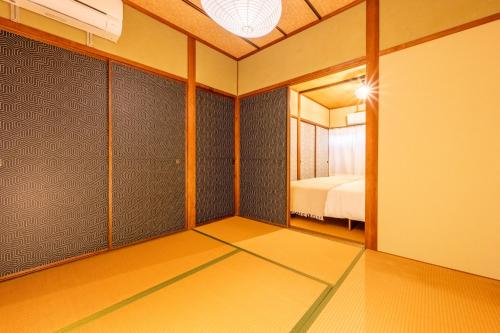 Ένα ή περισσότερα κρεβάτια σε δωμάτιο στο GUEST HOUSE Hotori 2nd