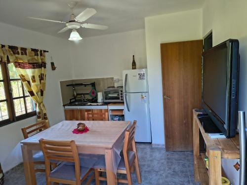 a kitchen with a table with a doll sitting on it at las palmeras departamento planta alta Catamarca in San Isidro