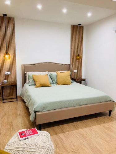 Ένα ή περισσότερα κρεβάτια σε δωμάτιο στο La Maison di Sara