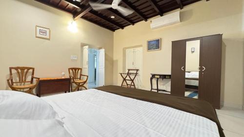 Ένα ή περισσότερα κρεβάτια σε δωμάτιο στο Grace Cottage, Ayoor