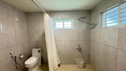 Ένα μπάνιο στο Grace Cottage, Ayoor