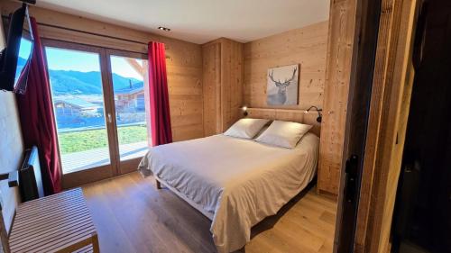 Postel nebo postele na pokoji v ubytování Chalet Luna superbe vue