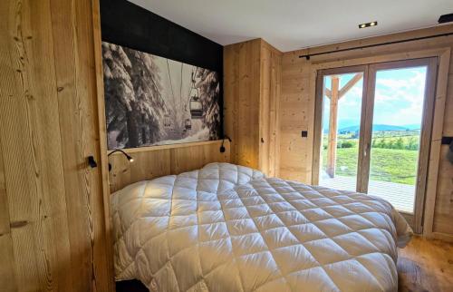 Ένα ή περισσότερα κρεβάτια σε δωμάτιο στο Chalet Papa Shelter vue époustouflante