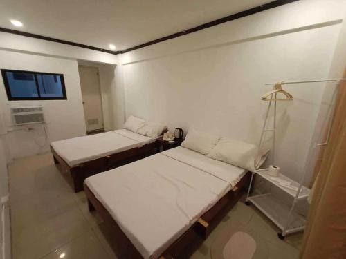 Postel nebo postele na pokoji v ubytování OYO 1180 Casa Del Sul