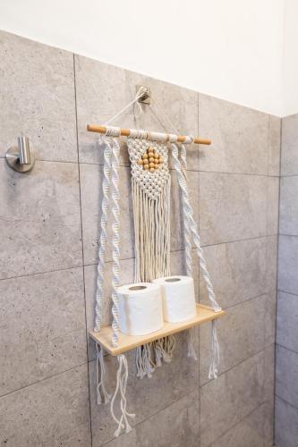 a shelf in a bathroom with a bunch of towels at Apartament de închiriat Accommodation nr 12 in Suceava