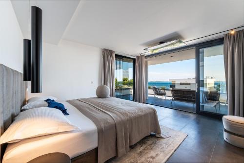 Ένα ή περισσότερα κρεβάτια σε δωμάτιο στο Suva Punta Luxe