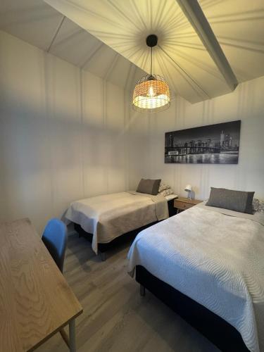 Postel nebo postele na pokoji v ubytování Pramea Apartments Tourula