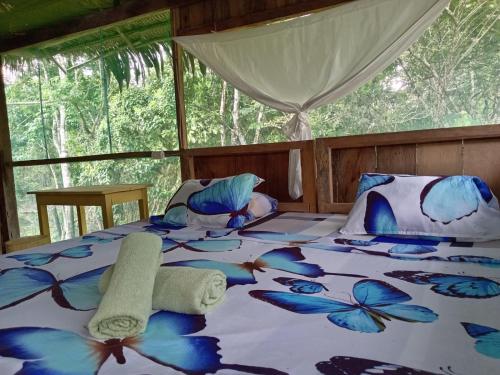 Ένα ή περισσότερα κρεβάτια σε δωμάτιο στο anguilla lodge expeditions