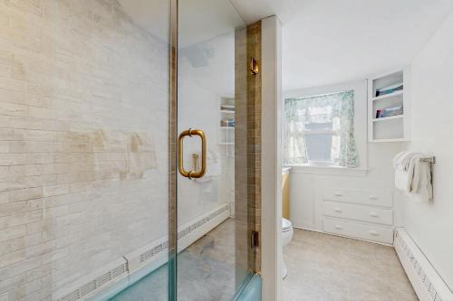 a bathroom with a shower and a toilet at Ledgewood 7 in Seal Harbor