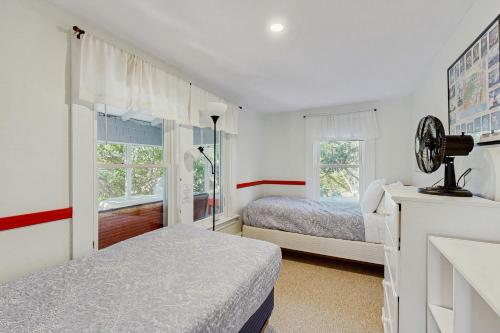 a bedroom with two beds and a window at Ledgewood 7 in Seal Harbor