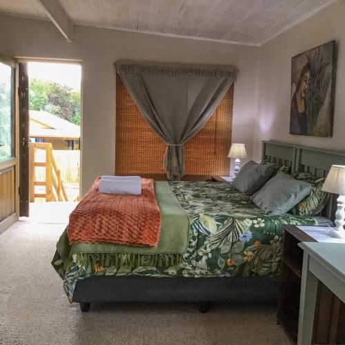 a bedroom with a bed and a window at Corner View Accommodation in Kaapsehoop