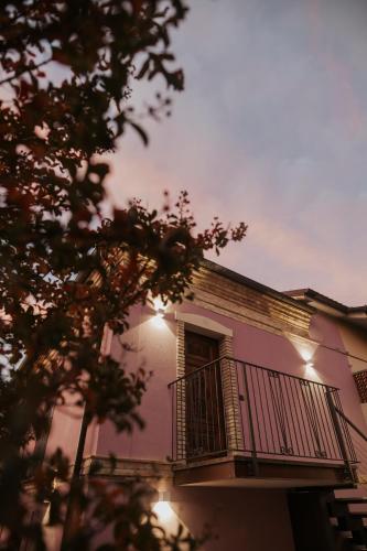 a building with a balcony with lights on it at B&B Lilà in Chieti