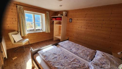 Ένα ή περισσότερα κρεβάτια σε δωμάτιο στο Ferienhaus Eckstoa