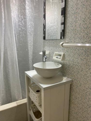 a bathroom with a sink and a shower at Toninas Relax in Las Toninas