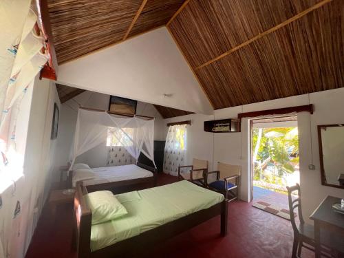 Postel nebo postele na pokoji v ubytování Mora Mora Resort