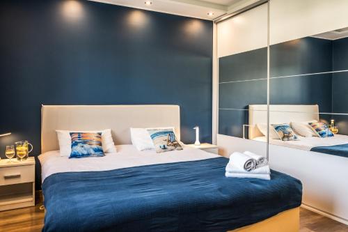 Postel nebo postele na pokoji v ubytování DreamHouse Apartament Zefir Północna 18B, Darłówko Wschodnie