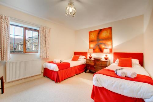 En eller flere senge i et værelse på Nyth y Wennol