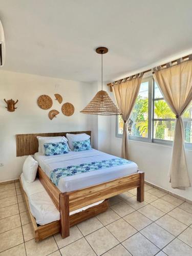 a bedroom with a bed in a room at Hostel Beach House in Rincón