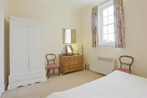 Ένα ή περισσότερα κρεβάτια σε δωμάτιο στο Garden View