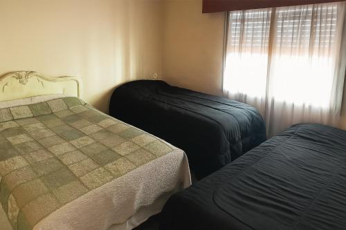 Postel nebo postele na pokoji v ubytování casa para 10 exc ubicacion garage 3 autos