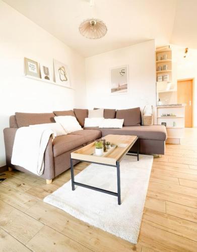 a living room with a couch and a coffee table at Havnkoje 2 in Westerbergen