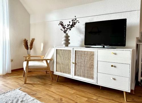 Télévision ou salle de divertissement dans l'établissement Havnkoje