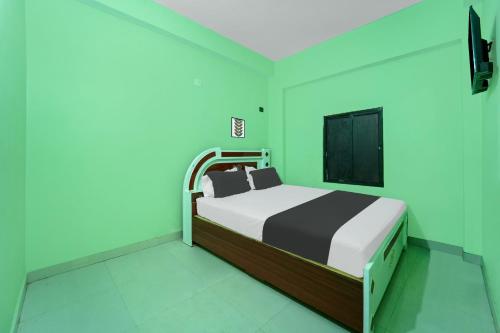 Ένα ή περισσότερα κρεβάτια σε δωμάτιο στο Hotel O Luxury