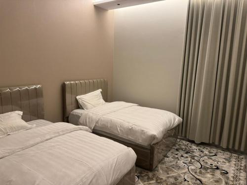 Ein Bett oder Betten in einem Zimmer der Unterkunft دايموند جدة للشقق الفاخرة