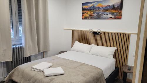 Giường trong phòng chung tại hotel de la gare