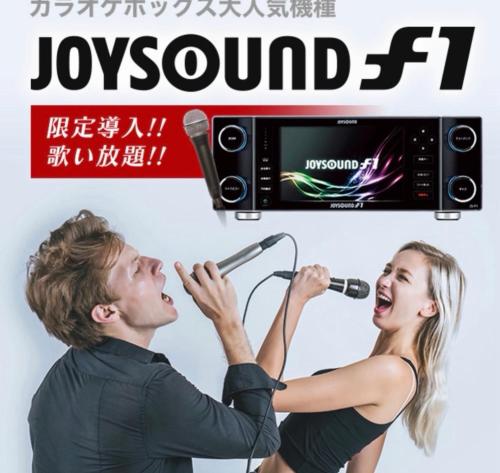 a man and a woman singing into a microphone at リンドス in Okayama